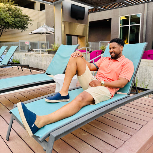 Mens Alpargata Rope Espadrille in Navy Recycled Cotton On Model Sitting on Chaise Lounge