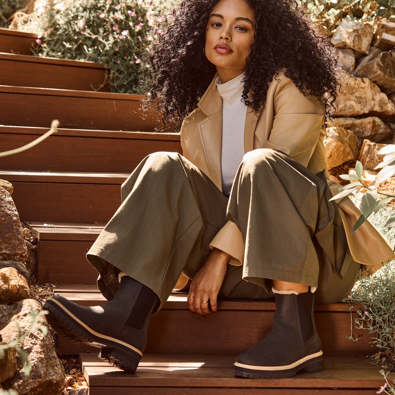 bennet chelsea lug boot on model in black leather with faux fur