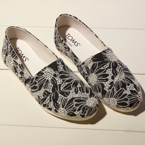 Laydown image of the Black Natural Oversized Floral Eyelet Alpargatas